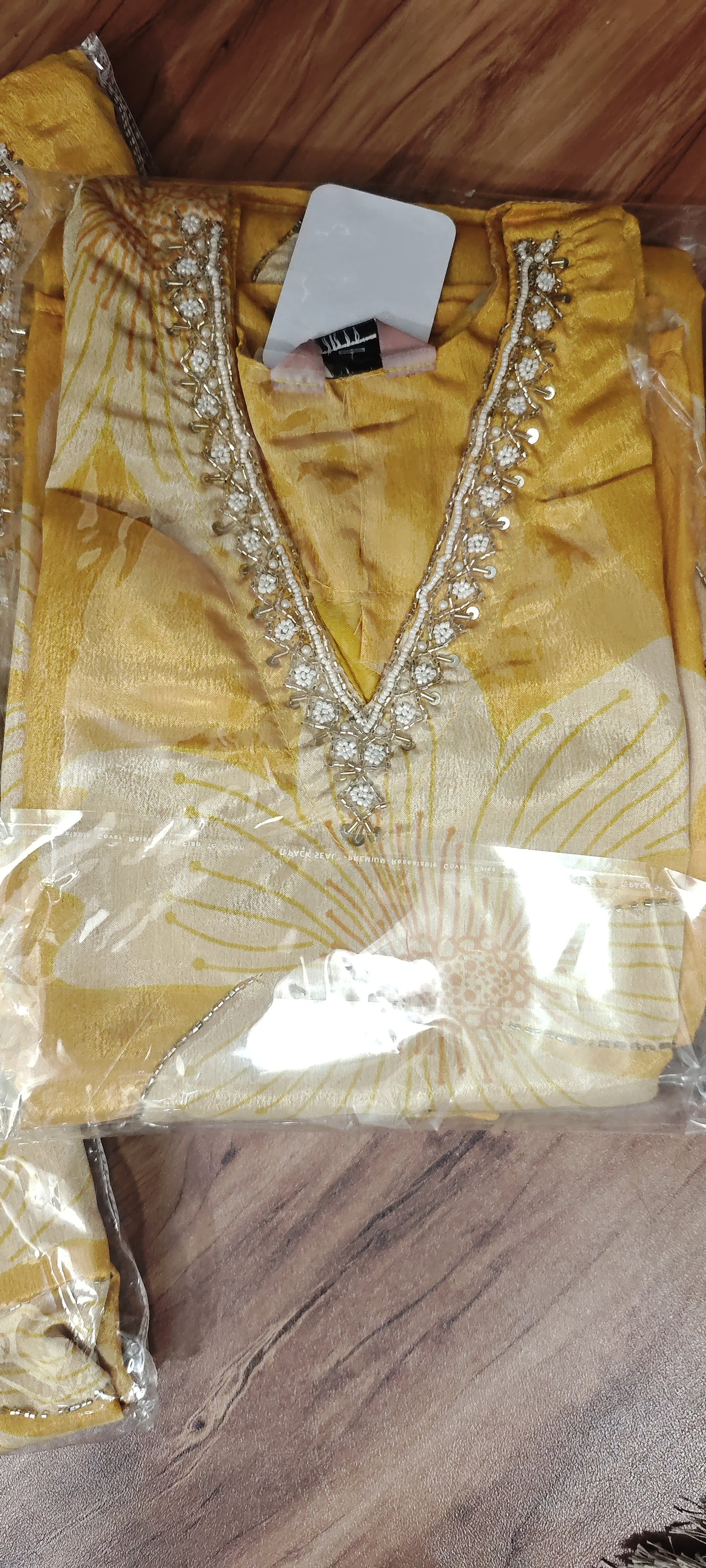 V Neck Yellow Suit with floral patterns and embroidery around the neckline